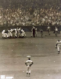 Branca walks to the clubhouse as the Giants exult.